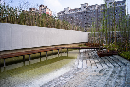Wooden bench and walkway in the park, closeup of photoの写真素材