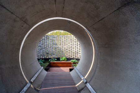 Concrete tunnel with a staircase in the middle of the park.の写真素材