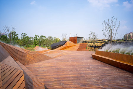 Wooden stairs in a park with blue sky background, Thailand.の写真素材
