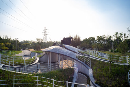 Landscape view of a park with a bridge over the river.の写真素材