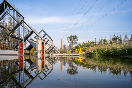 Landscape view of a canal in a city park in China.の写真素材