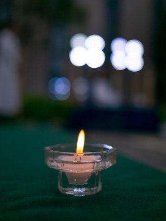 Candle light in the church with bokeh on background.の写真素材
