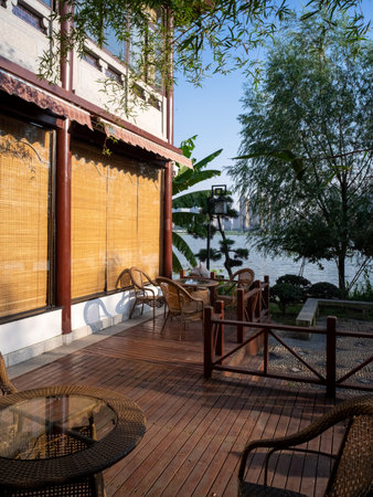 Tables and chairs on terrace of a building, Thailand.の写真素材