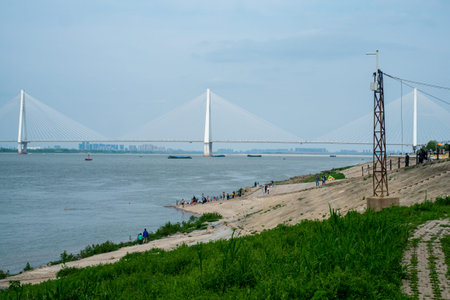 Wuhan, Hubei Province, China - April 05, 2023: The white Erqi Yangtze River Bridge stretches across...