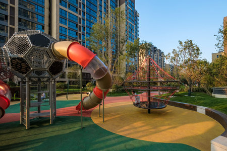 shangqiu, china - july 07, 2019: children playground with soccer ball themed climbing structures in...