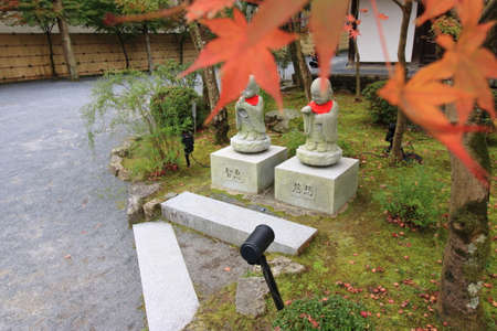 Jizo and autumn leavesの写真素材