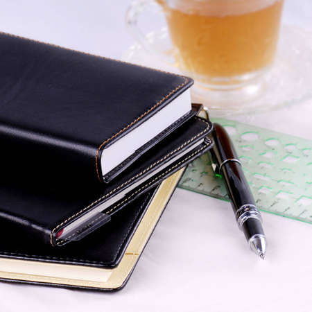 A pen and a number of booksの写真素材