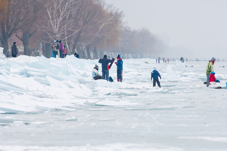 People walking and ice skating on the frozen Balaton Lake at Sifok, Hungary on 29th January, 2017のeditorial素材