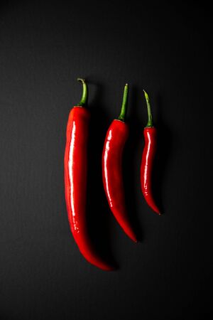 Top view of fresh chilli pepper on dark background. Top viewの写真素材