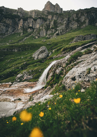 Small waterfall in the Bucegi Mountains, Romania. Selective focus.の写真素材