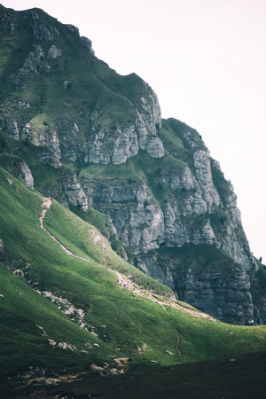 mountain landscape with green grass and rocks - retro, vintage style lookの写真素材