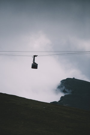 Cable car in the mountains on a cloudy day.の写真素材