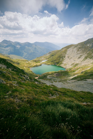 Beautiful mountain lake in the Carpathian mountains, Lake Capra,Fagaras,Romania.の写真素材