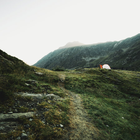 Camping in the mountains. Camping tent in the mountains.の写真素材
