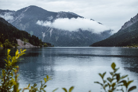 Mountain lake with fog in the background. Lake in the mountains.の写真素材