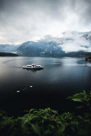 Foggy morning on Hallstatt lake in Austrian Alps.の写真素材