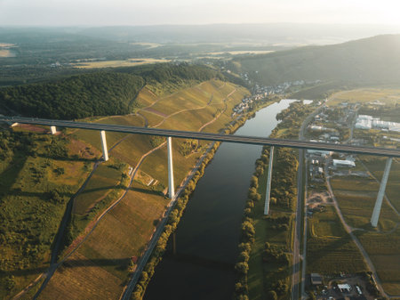 Aerial view of a bridge over the river in the evening.の写真素材