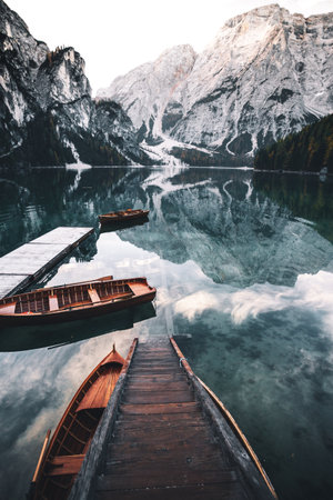 Lake braies in south tyrol, italy, with boatsの写真素材