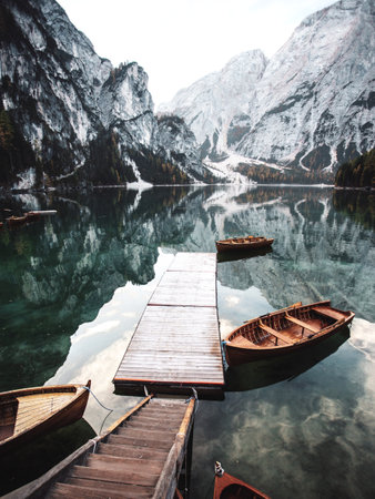 Lake braies in south tyrol, italy. Wooden boats on the lakeの写真素材