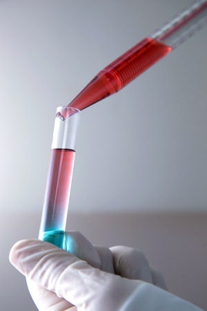 Drops falling pipette in the laboratory.の写真素材