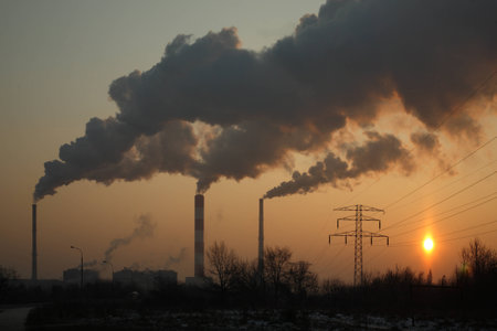 Chimney stack and smoke at first light の写真素材