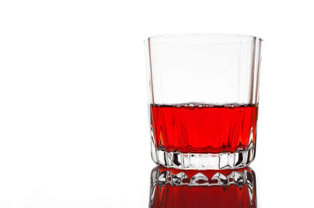 Glass of red juice on whiteの写真素材