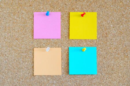 Cork board with colorful post-itの写真素材