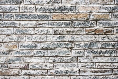 Gray grunge rough brick wall background.の写真素材