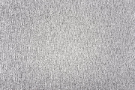 White fabric background. Gray canvas texture. Bright textile material background. Gray fiber...