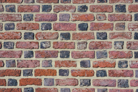 Red grunge brick wall texture.