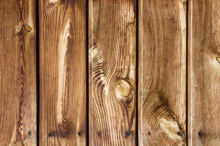 Grunge wood texture. Raw brown wooden wall background. Rustic tree desk with knots pattern. Countryside architecture wall. Village building construction.の写真素材