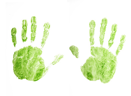 Hands prints on white paper background.の写真素材