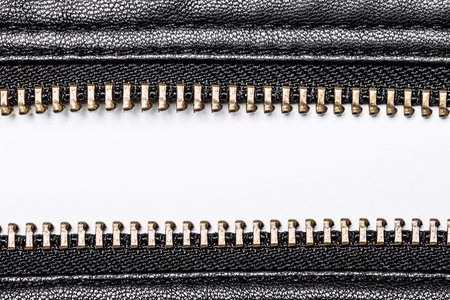 Black leather jacket zipper closeup. White empty copy space.の写真素材
