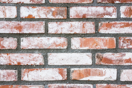 Red brick wall white paint background.