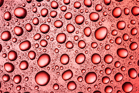 Water drops on glass surface texture.の写真素材