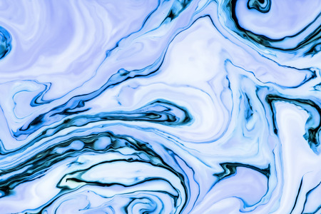 White and blue paint mixing background.の写真素材