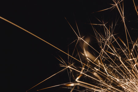 New years eve sparkler isolated on black. Shiny blow of firework sparks. Pyrotechnics empty copy...