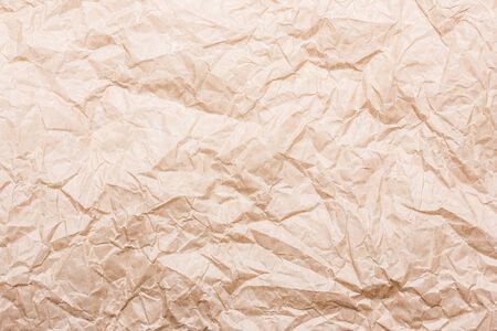 Brown stained and crumpled paper background.の写真素材