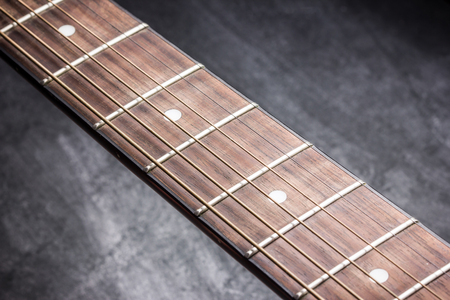 Grunge guitar fret board background.の写真素材