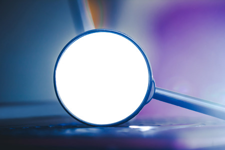 Search technology background. Magnifying glass with empty white copy space on computer keyboard with shallow depth of field.の写真素材