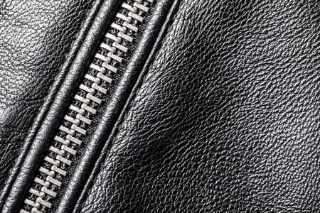 Black leather jacket metal zipper clothing fashion background.の写真素材