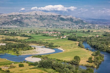 Albania Shkoder city seen from the top of the mountain. Beautiful landscape with river during sunny summer day.の写真素材