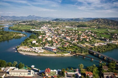 Albania Shkoder city seen from the top of the mountain. Beautiful landscape with river during sunny summer day.の写真素材