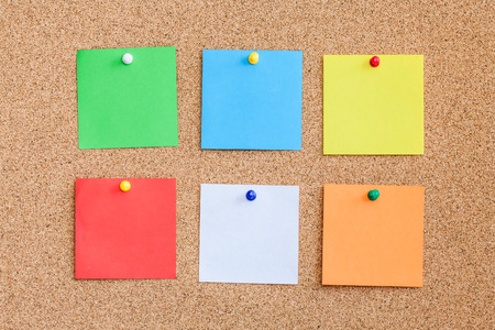 Six color memo reminder cards pinned to cork board. Blank empty copy space square papers background.の写真素材