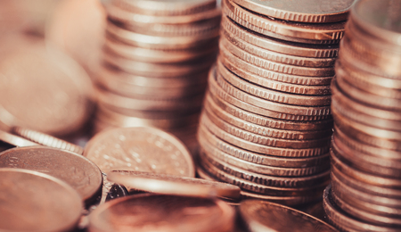 Money coins stacks business and finance golden color background.の写真素材