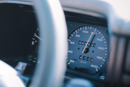 Old car speedometer. Transport, travel and speeding background.の写真素材