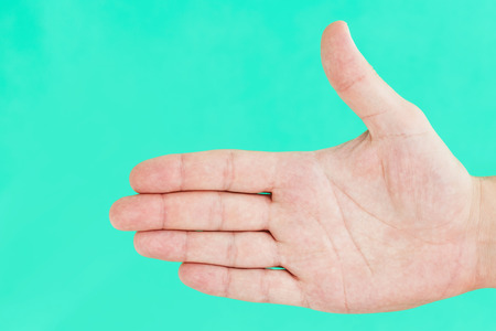 Giving hand to welcome, say hallo gesture isolated on green screen.の写真素材