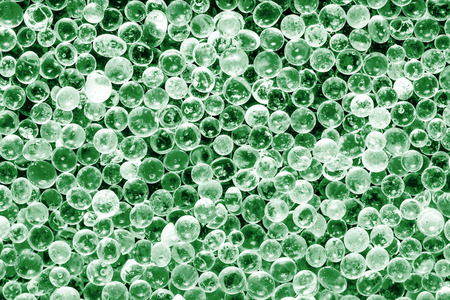 Crystal green shiny round objects texture.の写真素材