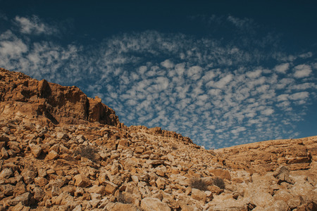 Rocky hill on desert in Israel. Ramon crater landscape.の写真素材