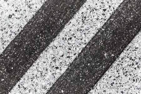 Black asphalt road white paint lines.の写真素材